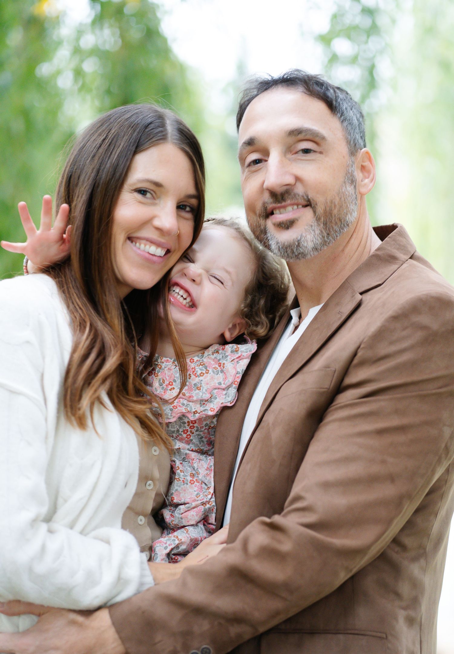 A series of connected photos showing a cake smash photography session with soft natural lighting and white teepees outdoors.