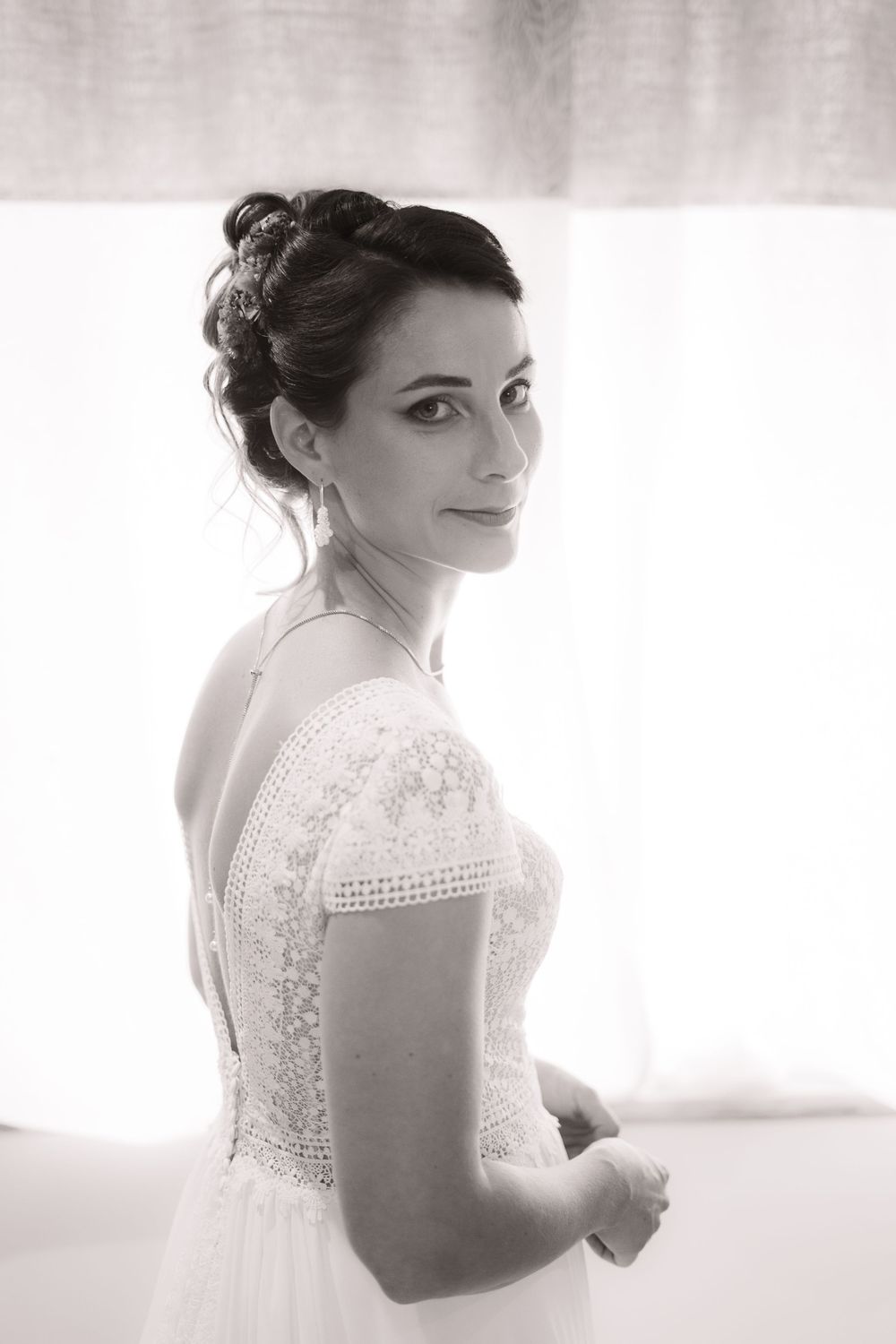 Elegant bride in a vintage-inspired lace wedding dress shown in a series of soft, ethereal portraits.