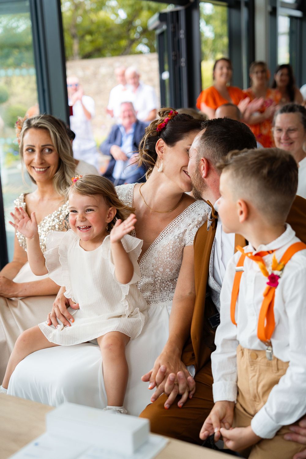 Wedding celebration scene showing joyful reactions during a special moment.