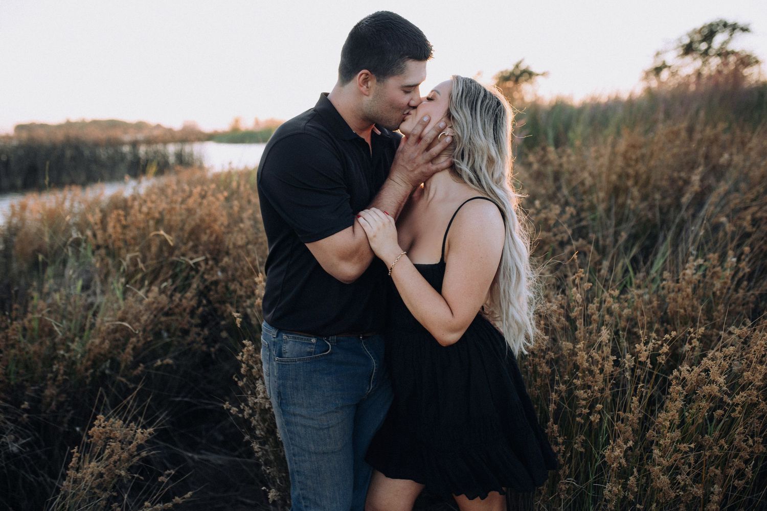 Couple embracing during an outdoor engagement session in North Idaho