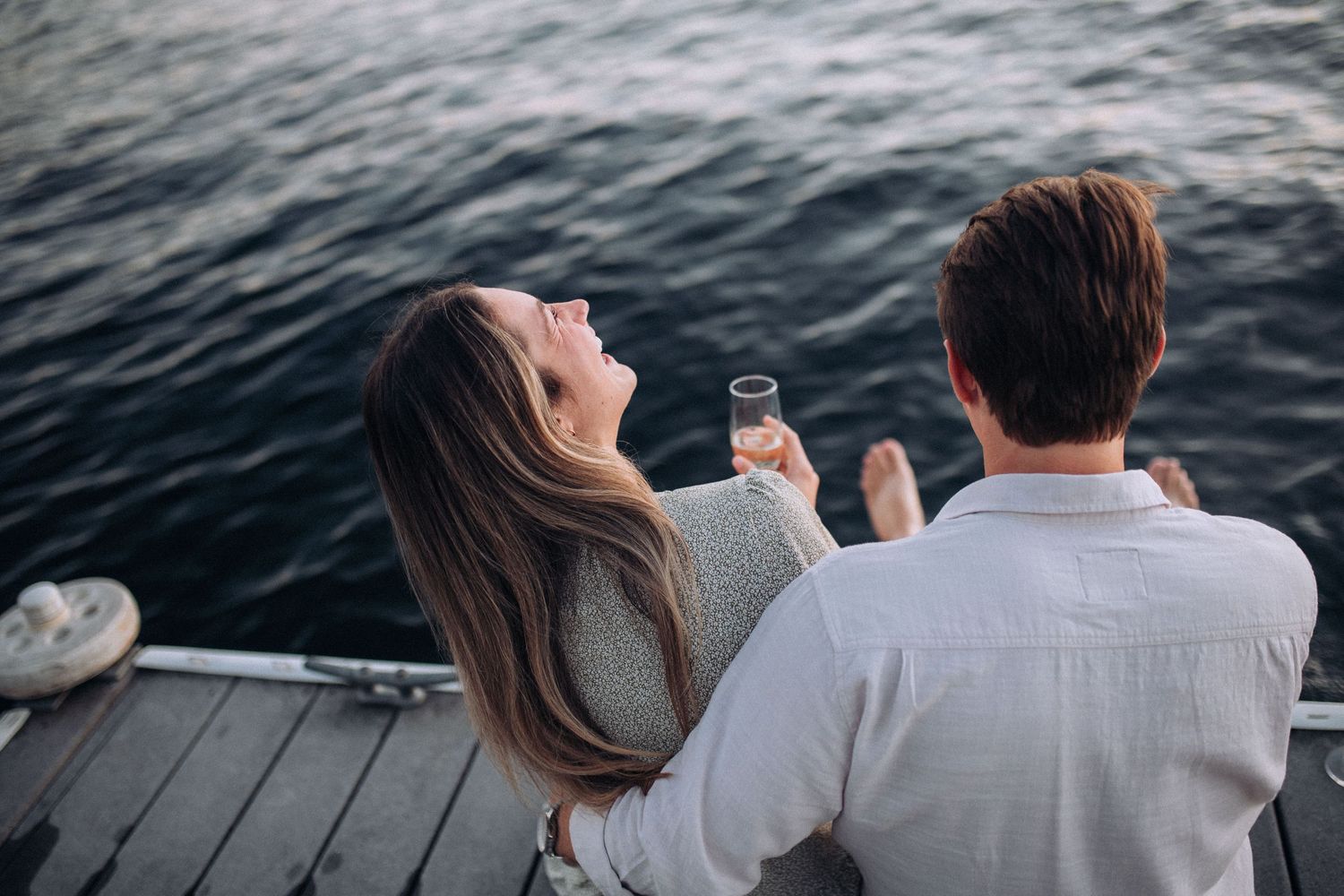 Engaged couple during a romantic engagement session on Coeur d’Alene Lake in North Idaho