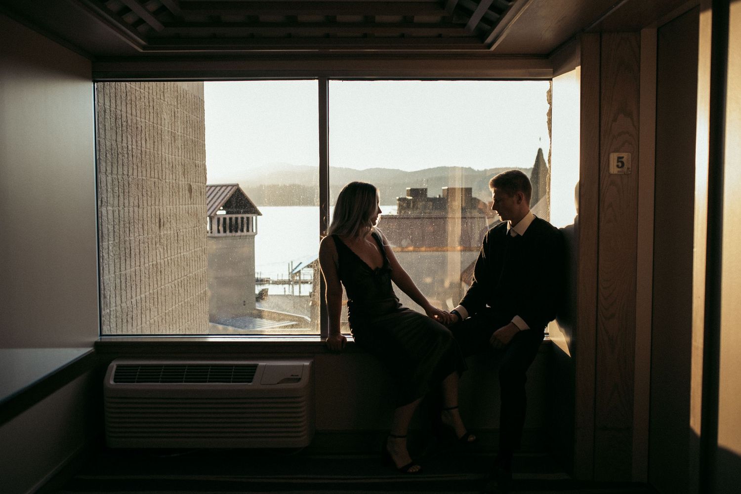 Engaged couple at the Coeur d’Alene Resort during a lakeside engagement session in Idaho