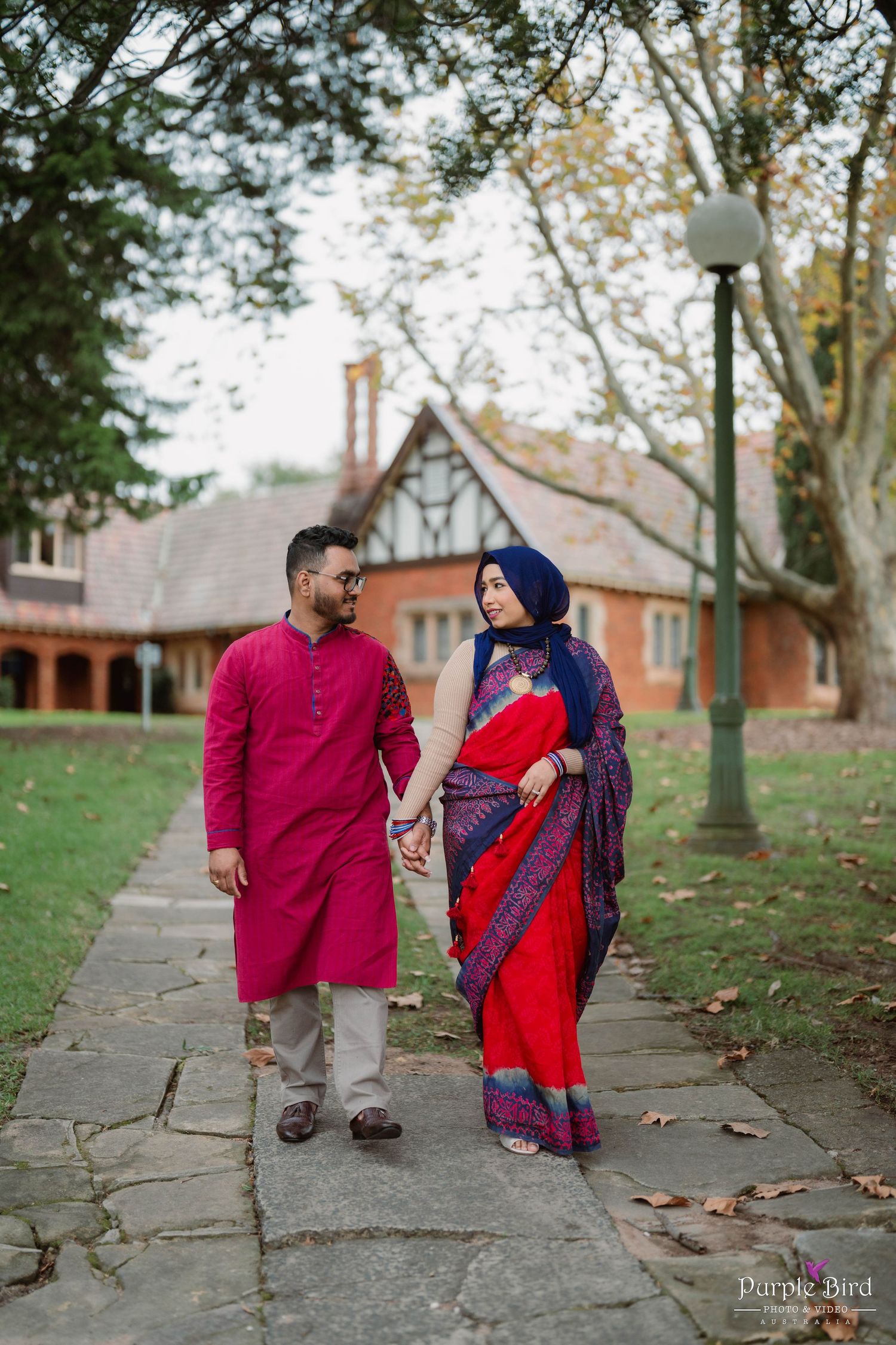 A couple walking along a stone path surrounded by autumn trees, captured in a series of candid moments.