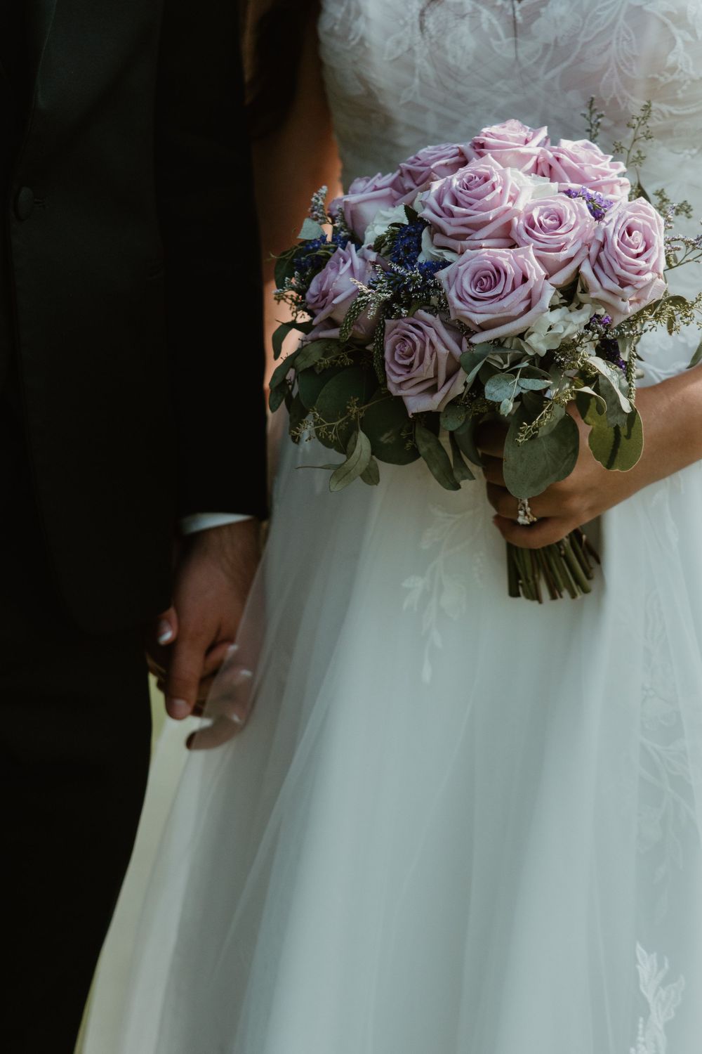 A series of images showing a lavender bridal bouquet held against a white wedding gown featuring roses and eucalyptus leaves.