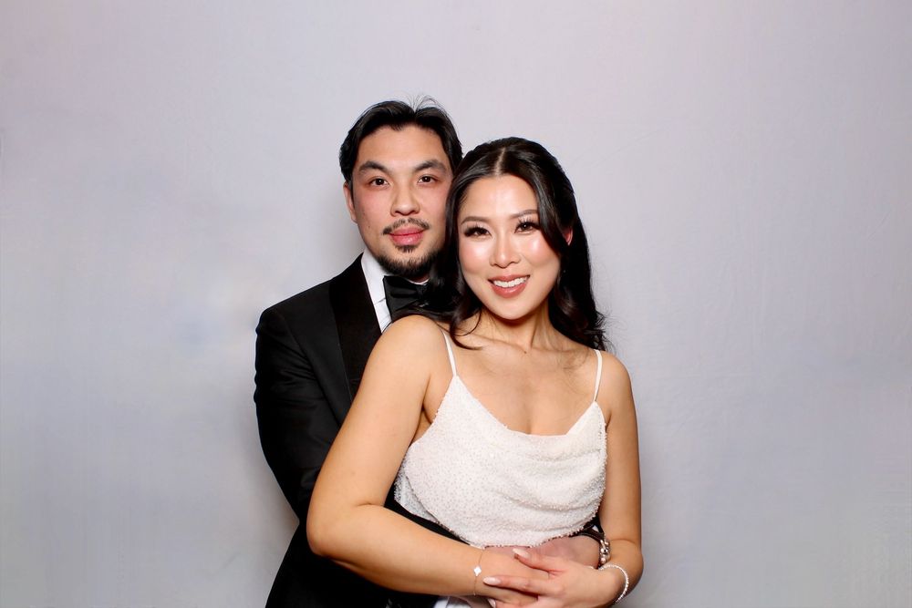 Couple in formal attire pose together for a series of wedding or engagement photos with black and white effects.