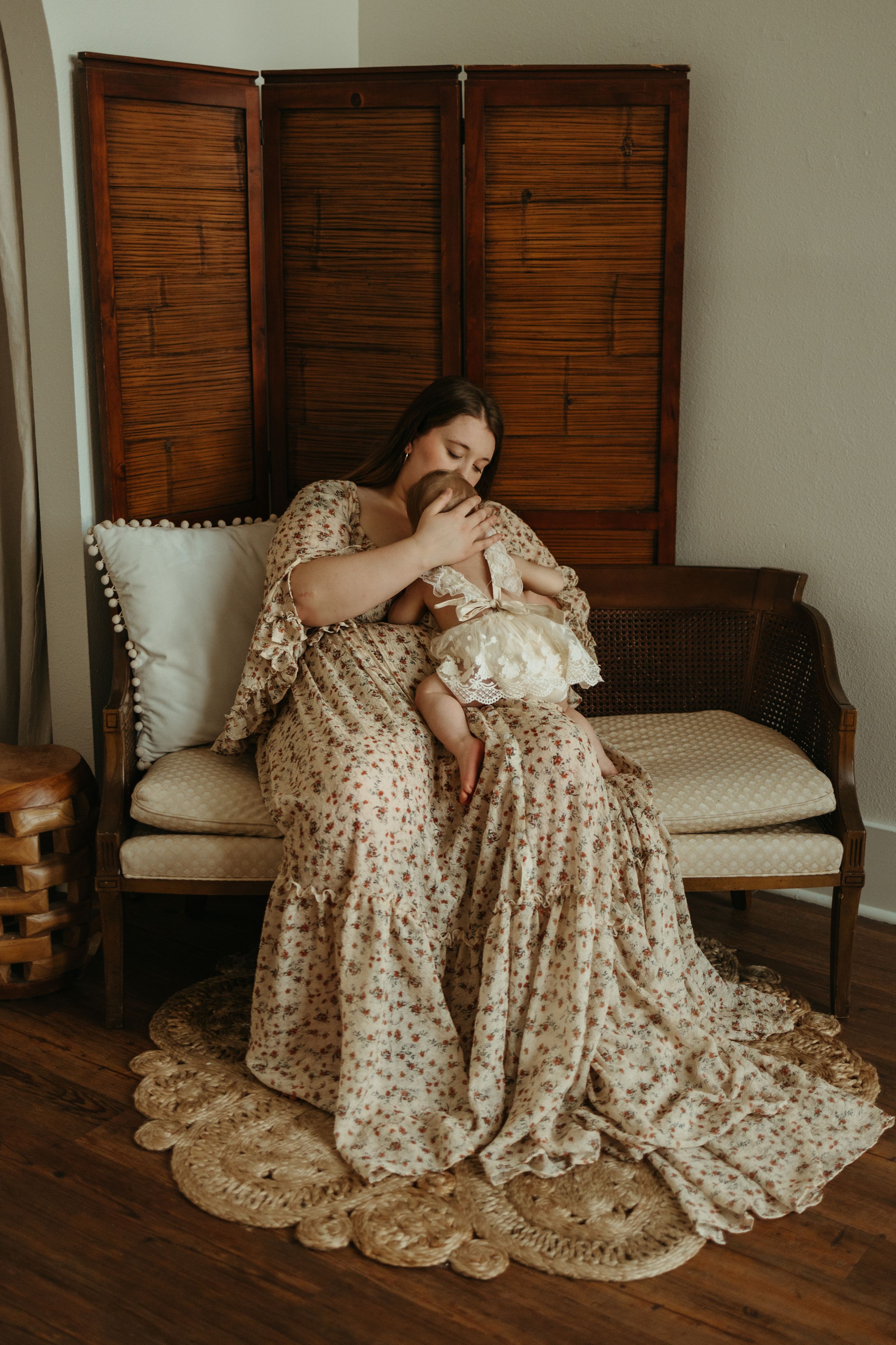 A series of photos showing a person lounging on a bench in a flowing floral dress with wooden shutters in the background.
