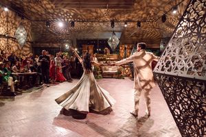 Bride and groom dancing and celebrating at Johannesdal 1207 wedding reception Sangeet