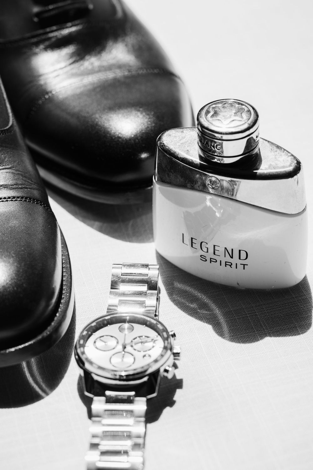 A series of artistic black and white photos showing close-up details of luxury wristwatches and watch faces.