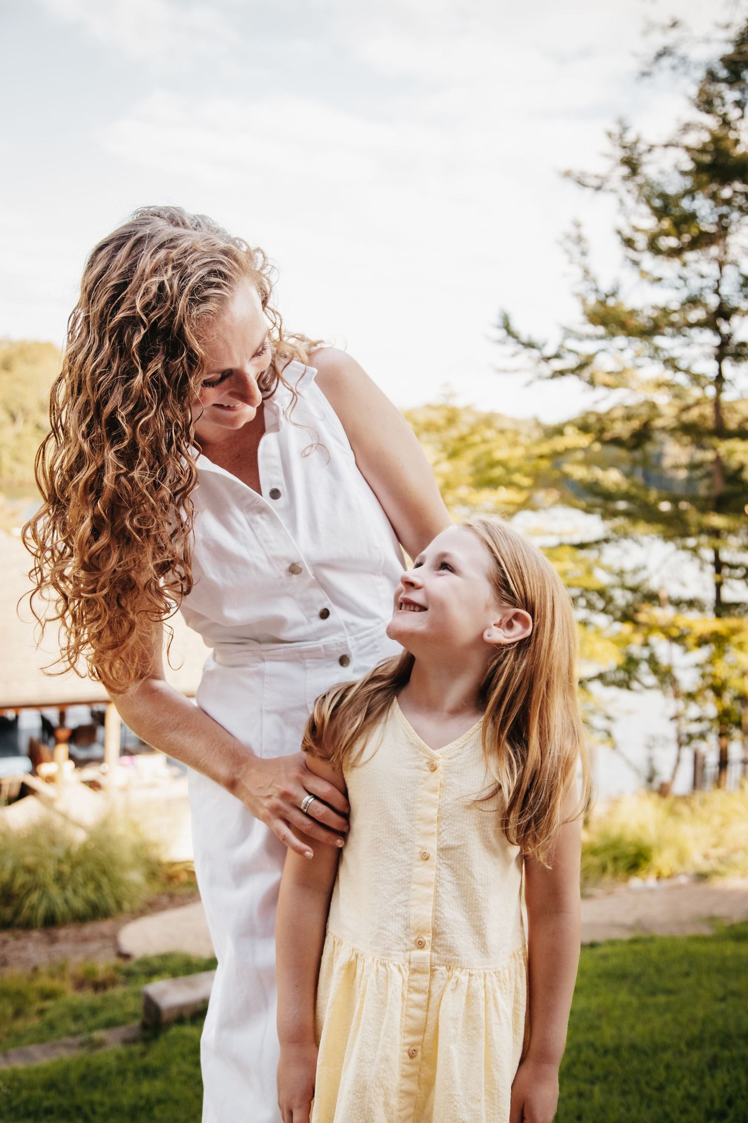 Mother and daughter smiling at each other.