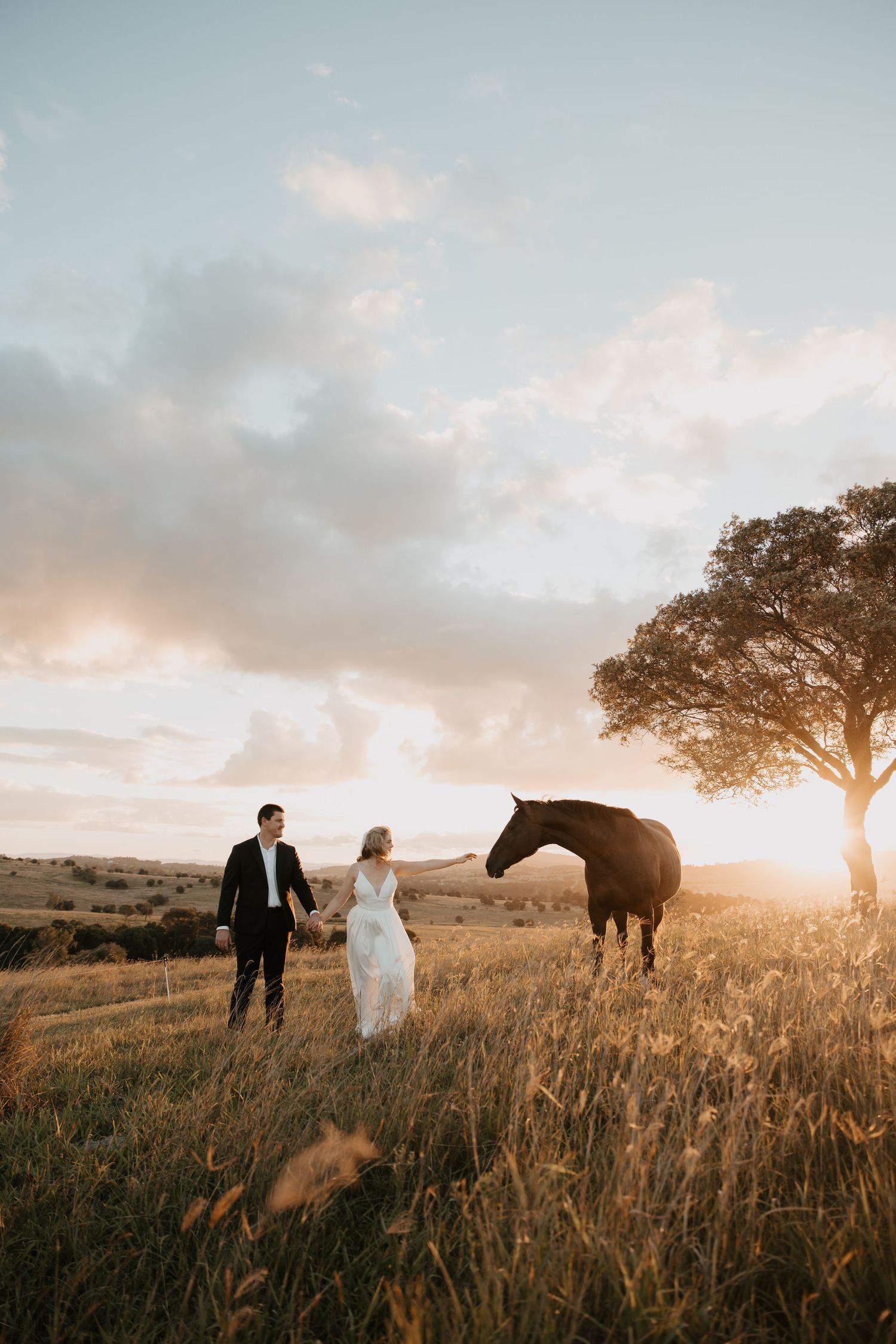 Outdoor wedding ceremony scene with natural greenery and garden setting.