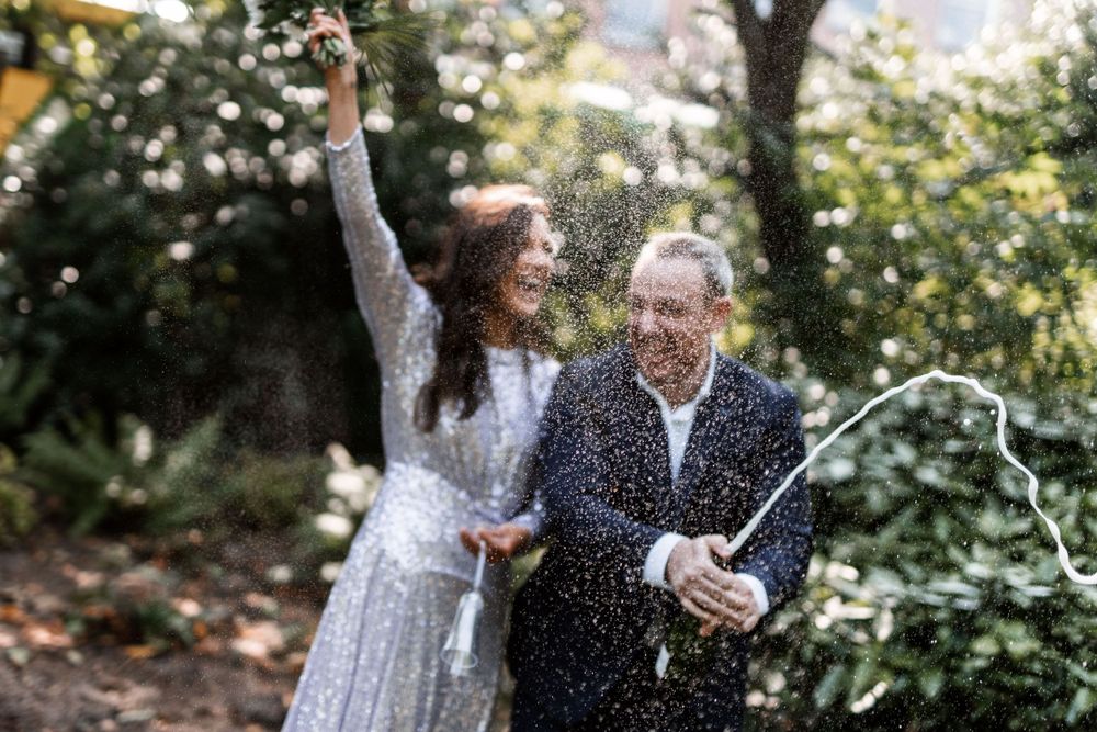 Champagne spray celebration after a wedding reception in Dublin's registry office.