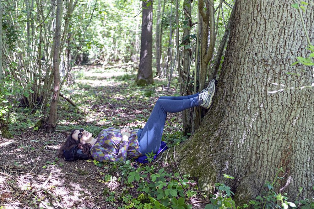 Woodland Well-being project images for the Suffolk Wildlife Trust - A person resting in woodland, Suffolk