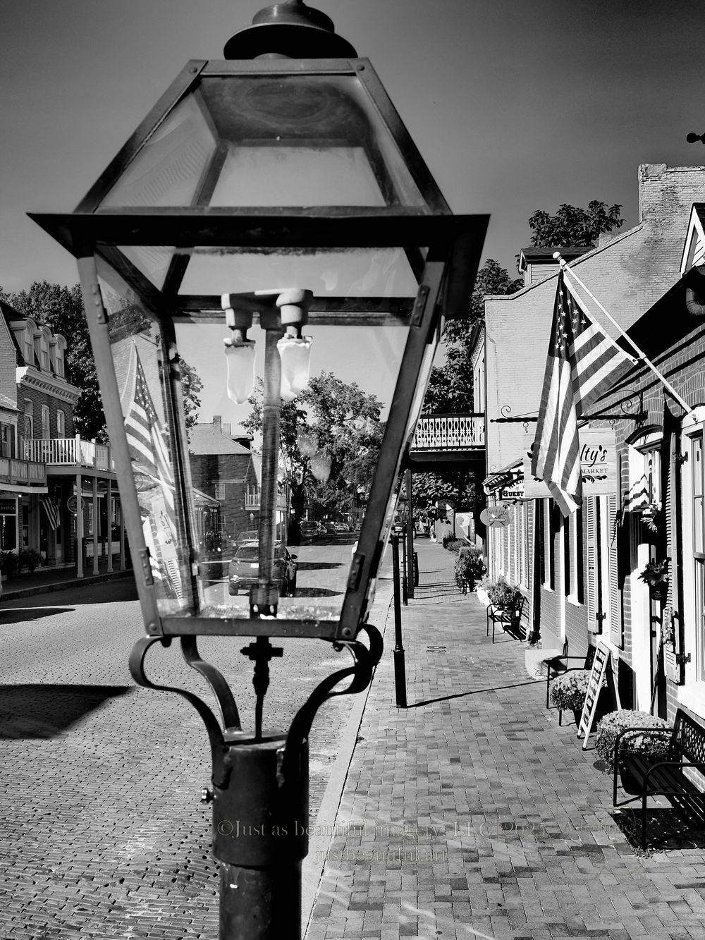 Achromatic photo of lamp post on Historic Main Street in Saint Charles, Missouri.