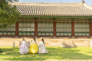 Traditional Korean palace buildings with distinctive tiled roofs viewed from the courtyard.