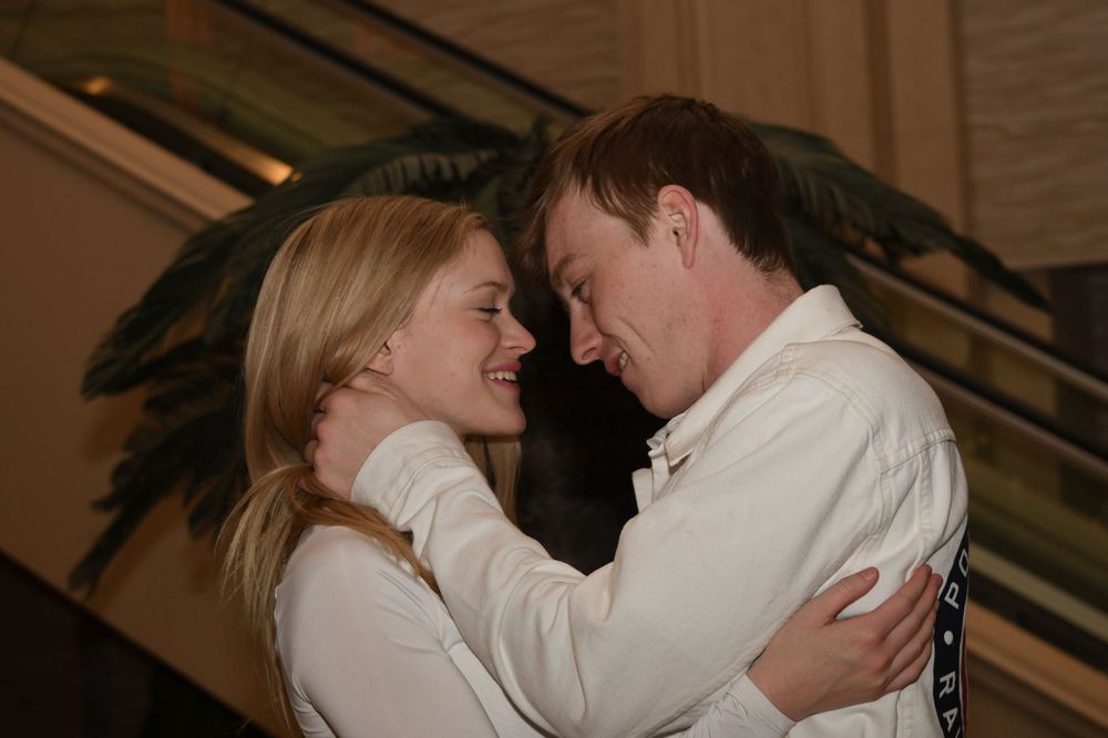 A romantic close-up of a couple sharing an intimate moment.