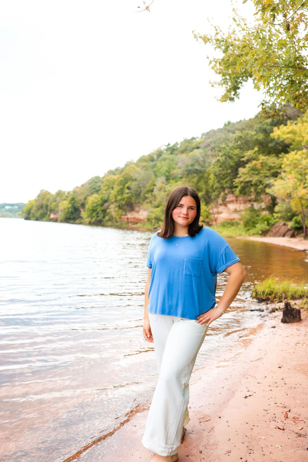 Stillwater, MN photographer poses on the lake.