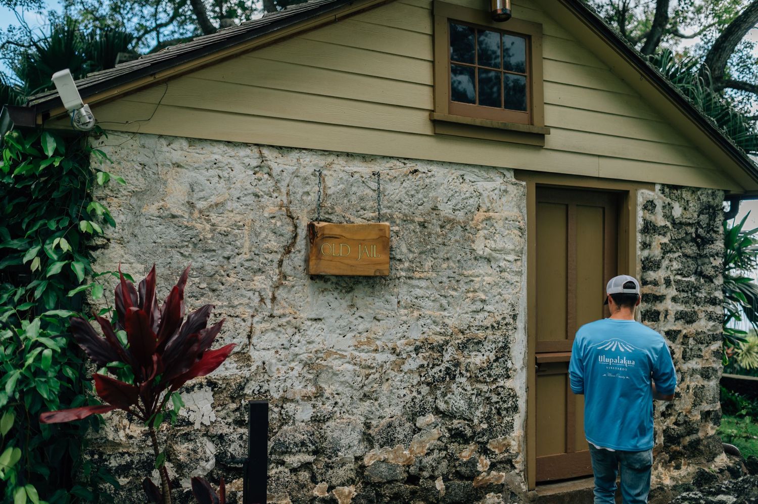 Stone and wood building exterior with rustic architectural details and wooden door.