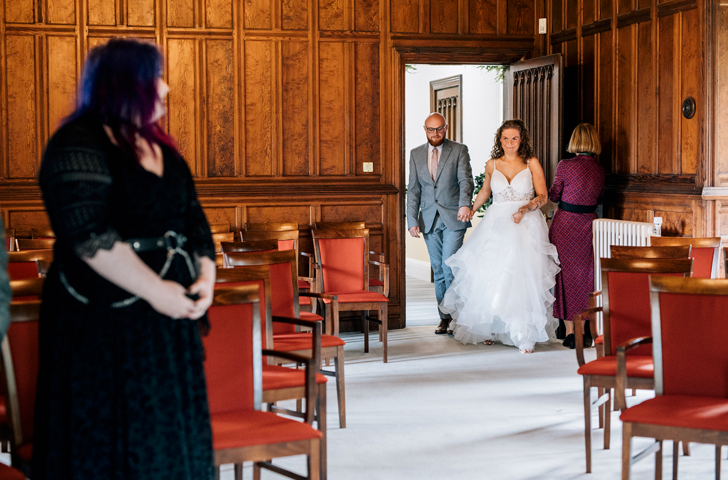 A series of wedding photos showing couples dancing and celebrating in an elegant wood-paneled reception hall.