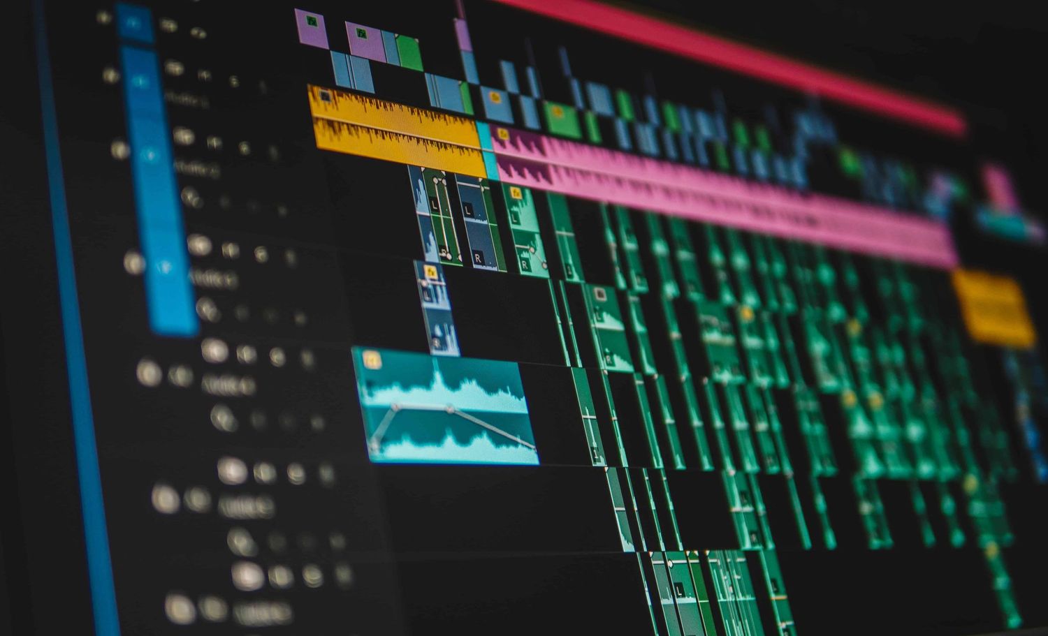 Digital trading interface showing multiple financial charts and data displays with glowing blue and green screens.