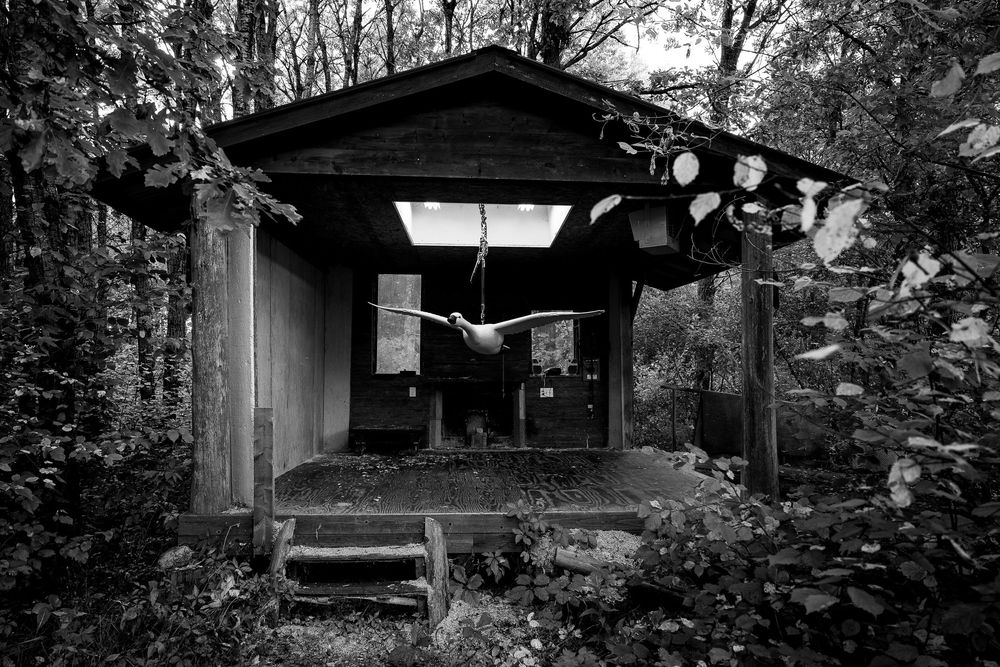 Black and white photos show traditional Japanese architecture with wooden structures and sloping roofs in a garden setting.
