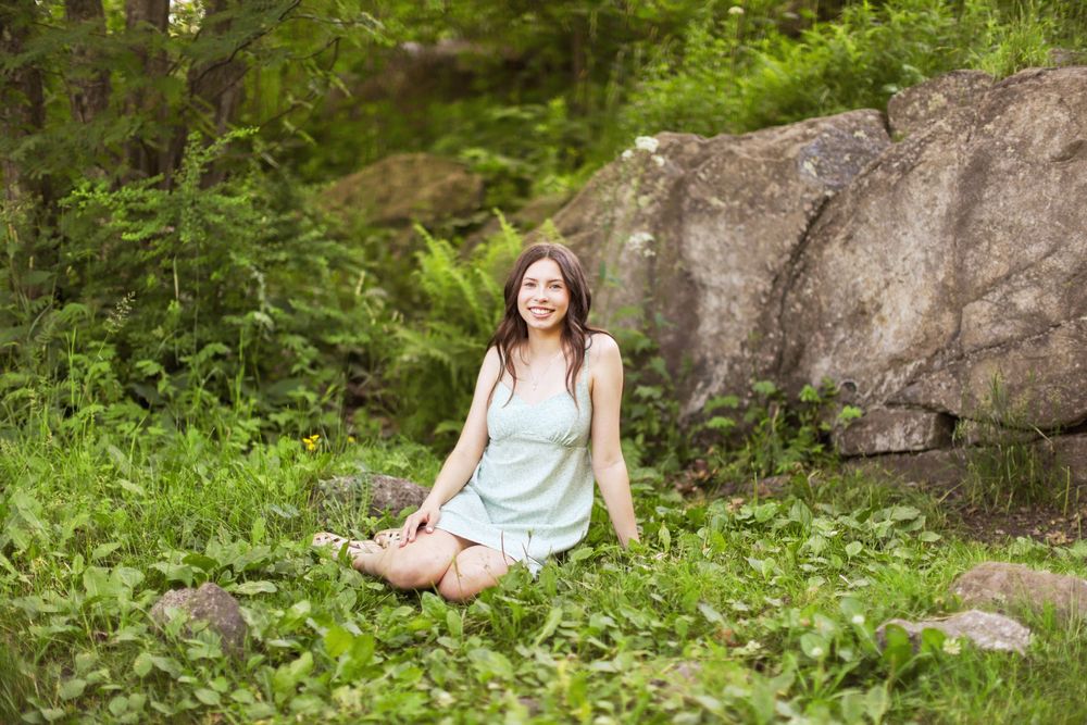 Senior girl smiling during a photo session at Enger Tower Park in Duluth, MN