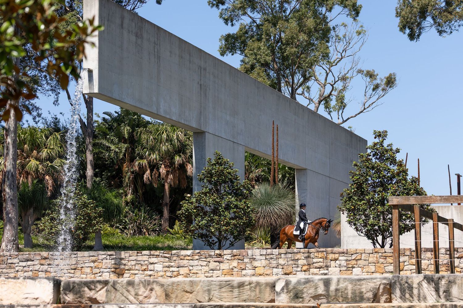 Grand Prix dressage rider Hannah Rockwell and Baumann's Diorella amongst the gardens and fountain at Willinga Park. © Simon Scully 2026.