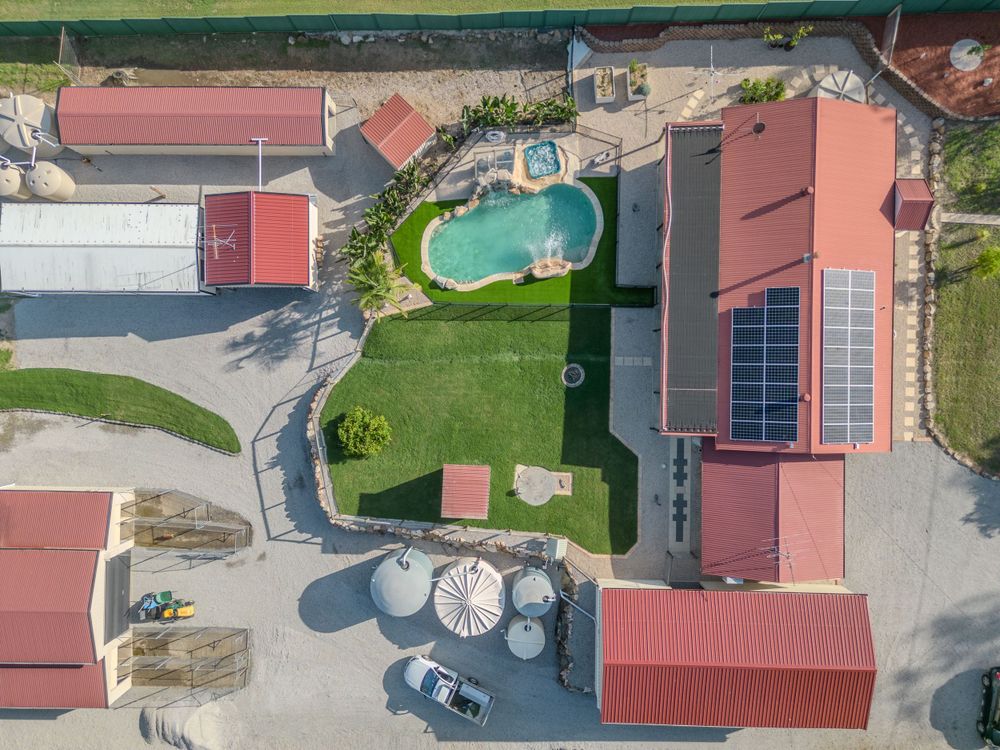 Aerial drone view of acreage home and pool by Gold Coast and Brisbane real estate photographer