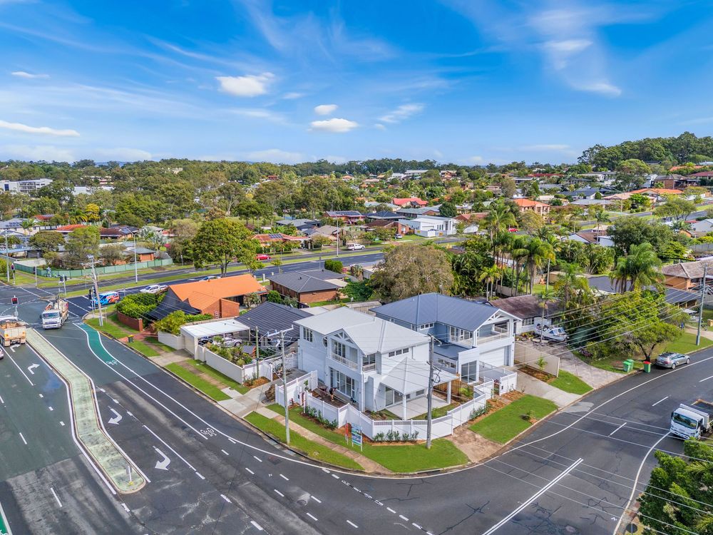Aerial drone photo of a modern corner-block home and surrounding suburb, captured for real estate listings in Brisbane and the Gold Coast.