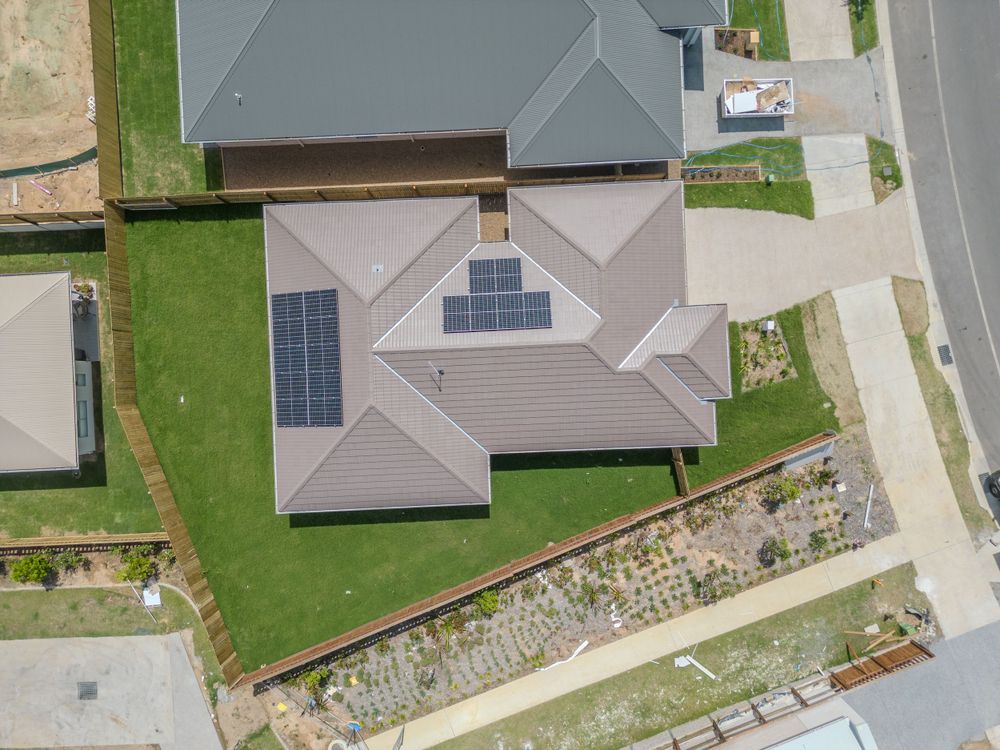 Drone photo of modern home with solar panels by Gold Coast and Brisbane real estate photographer
