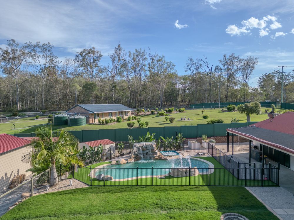 Drone photo of landscaped property with pool captured by Gold Coast and Brisbane real estate photographer