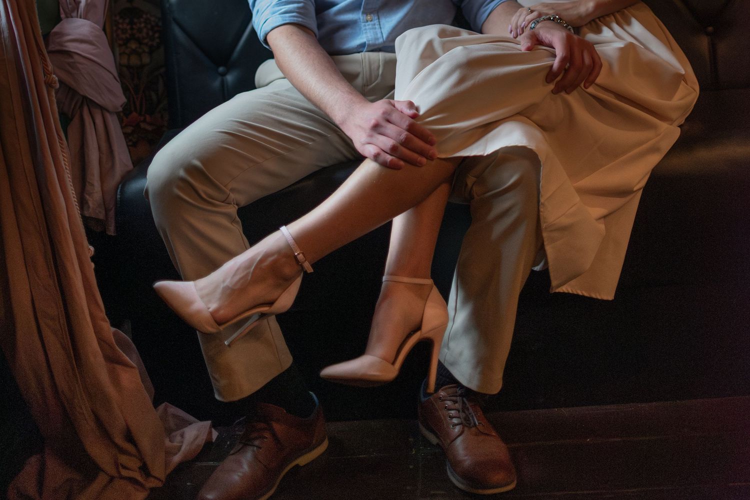 Couple sitting together at Greenfields Coffee in Salado Texas during lifestyle session