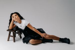 A series of artistic black and white boudoir photographs showing poses on a wooden floor.
