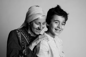 A black and white collage of intimate family moments showing affection and connection between parent and child.