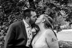 Black and white wedding photography sequence capturing romantic moments between couple.