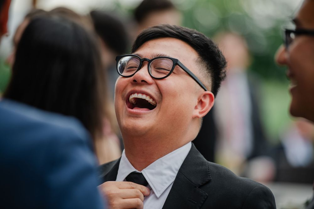 A sequence of candid moments showing joyful laughter and genuine expressions during an outdoor celebration.