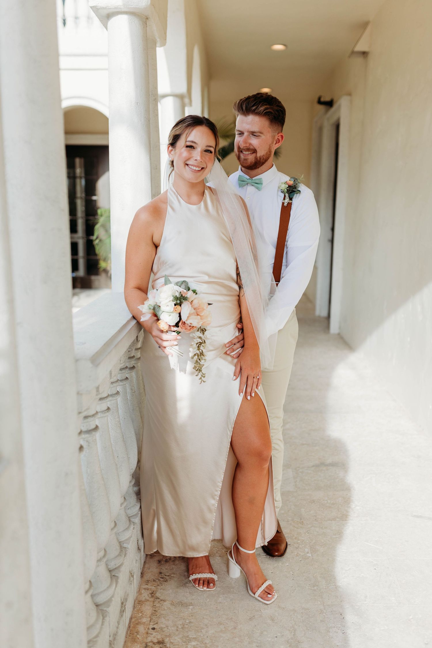 Bride and groom walking together during a wedding photography session.