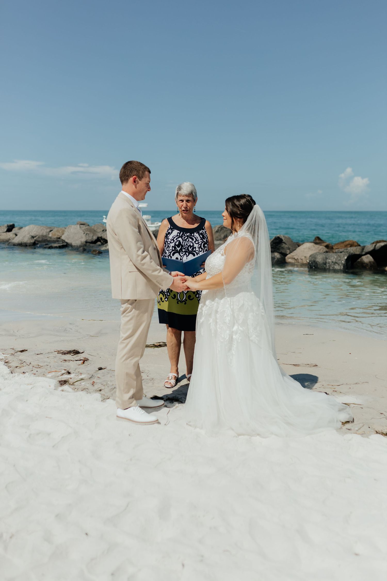 Bride and groom walking together during a wedding photography session.
