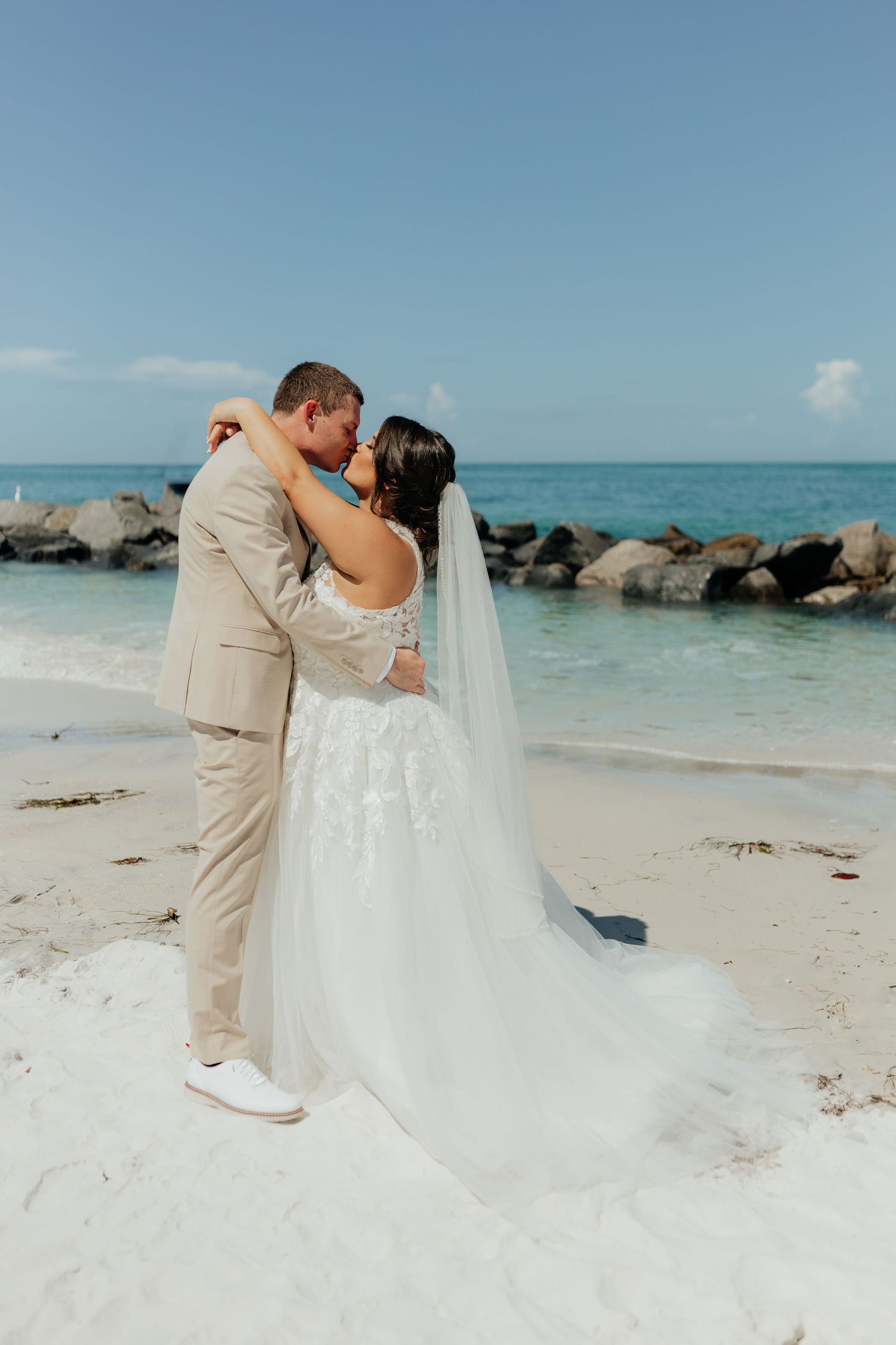 Bride and groom walking together during a wedding photography session.