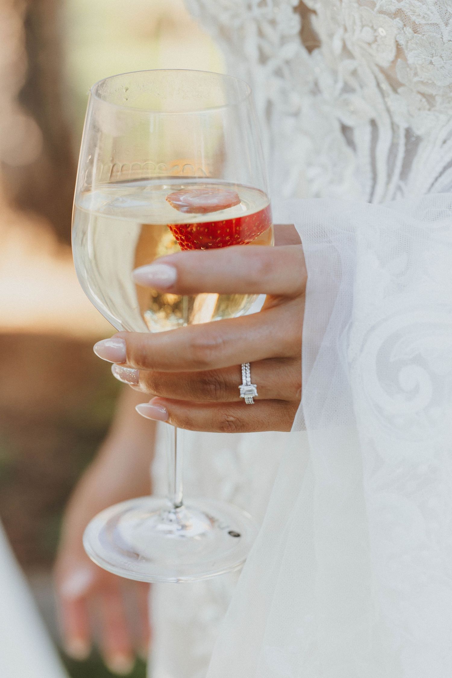 Champagne glass held during a wedding celebration.