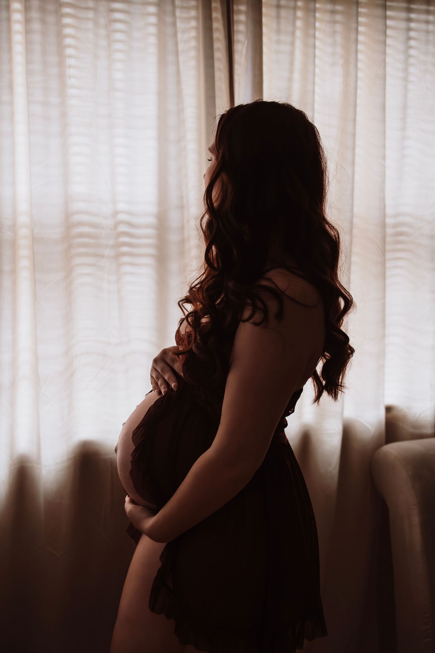 Fine art maternity boudoir photography taken in a cozy Hudson Valley photography studio space.