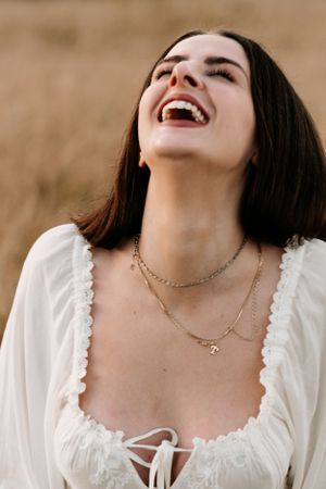 Close-up portrait series showing joyful expressions and delicate jewelry details.