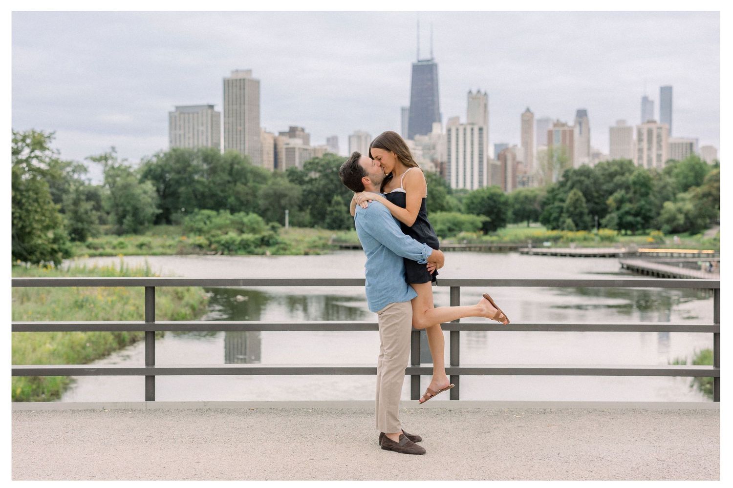 Romantic Lincoln Park boardwalk proposal surrounded by greenery in Chicago.