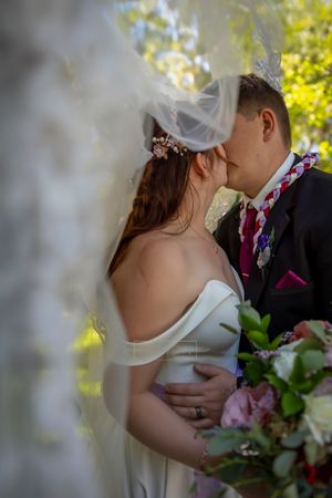 veil image couple kissing Wedding @ Wild Rose Manor