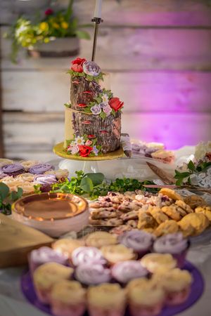 dessert table with wedding cake and cookies