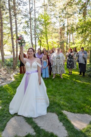 bride tossing bouquet