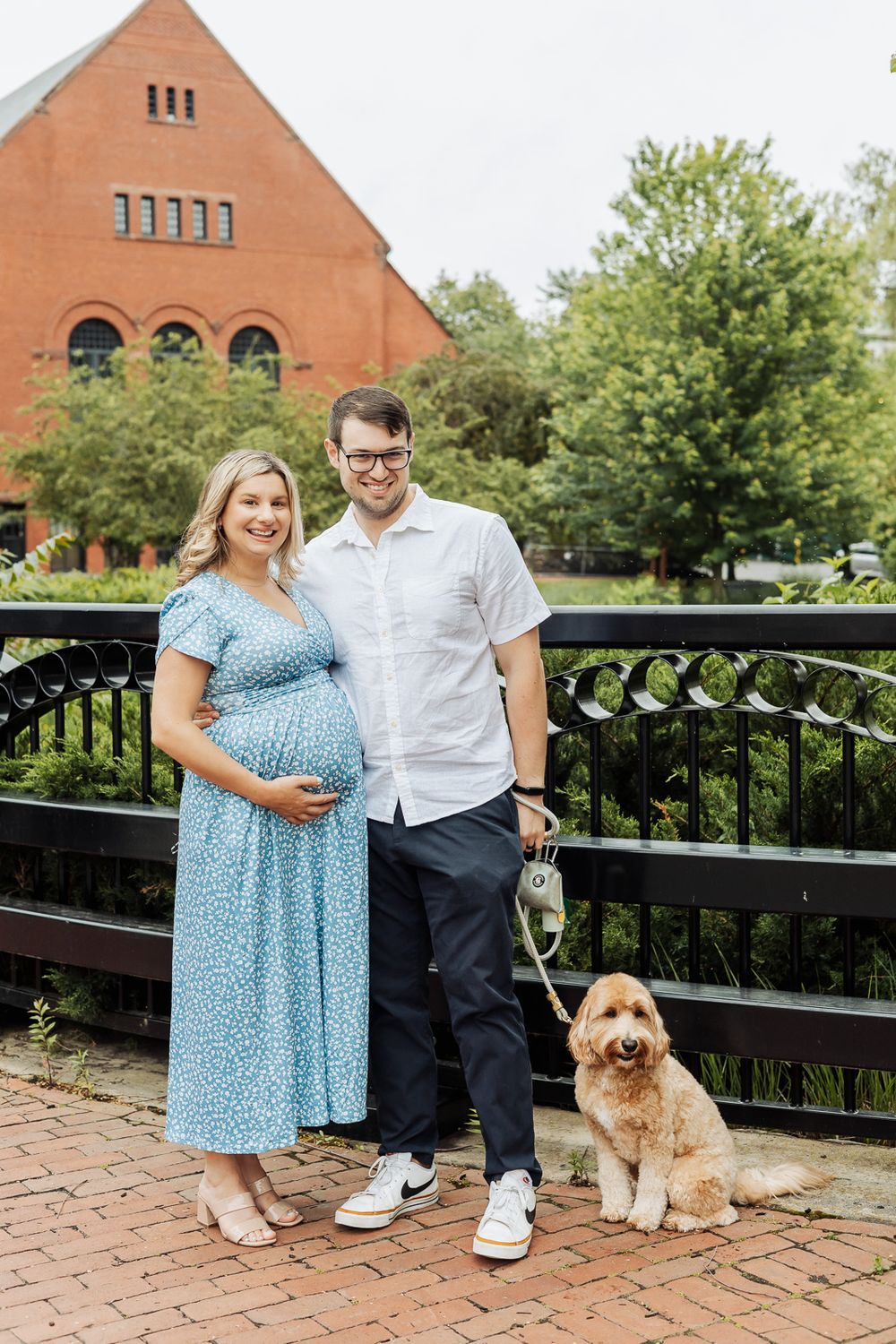 A couple stands together on a brick patio with their chow mix dog in a series of four connected photos.