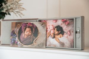Modern photography studio interior with elegant wall-mounted portrait displays.