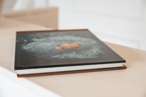 Multiple photography prints arranged on a clean white surface showing portfolio work.