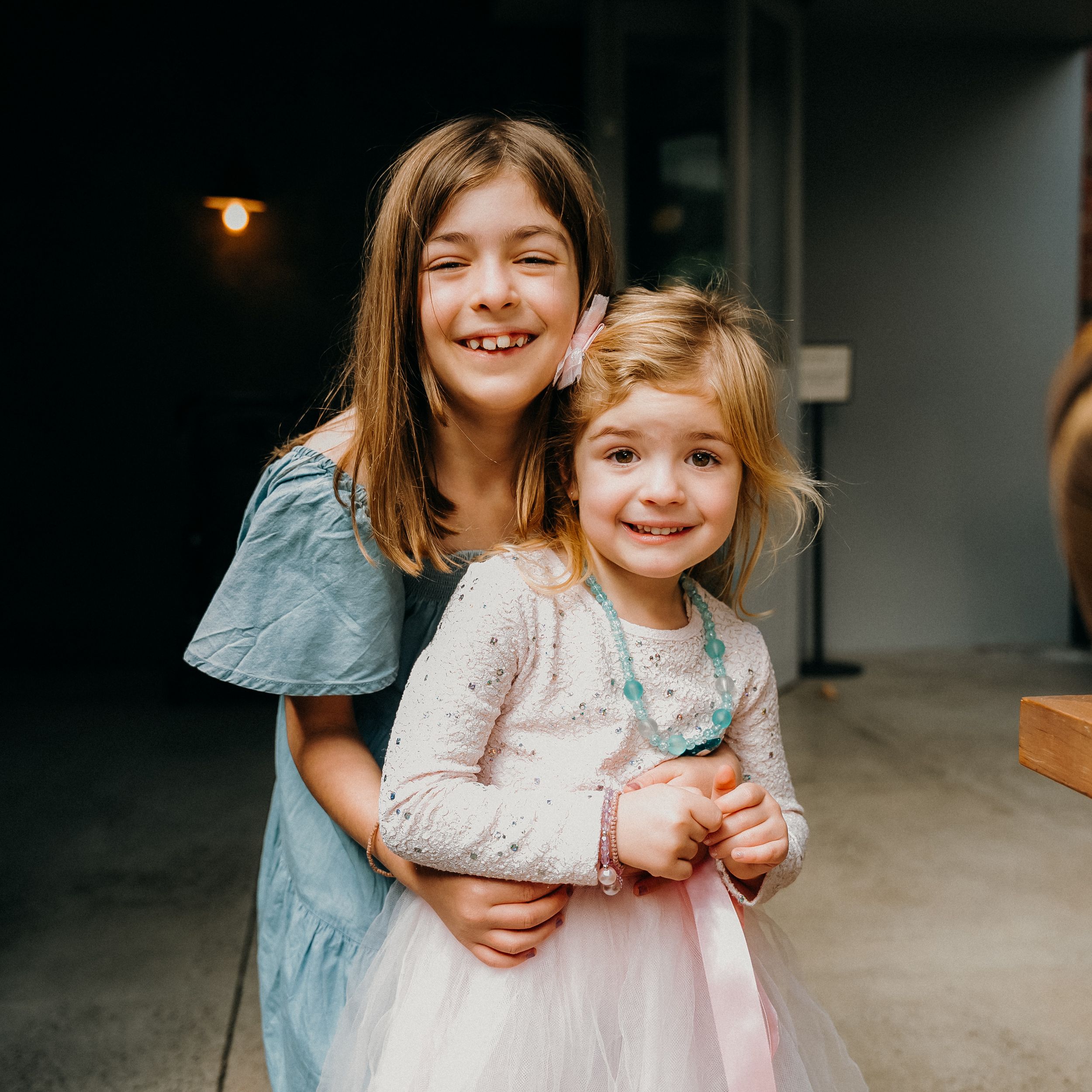 A sequence of candid moments showing joyful interactions between two people in casual indoor lighting.