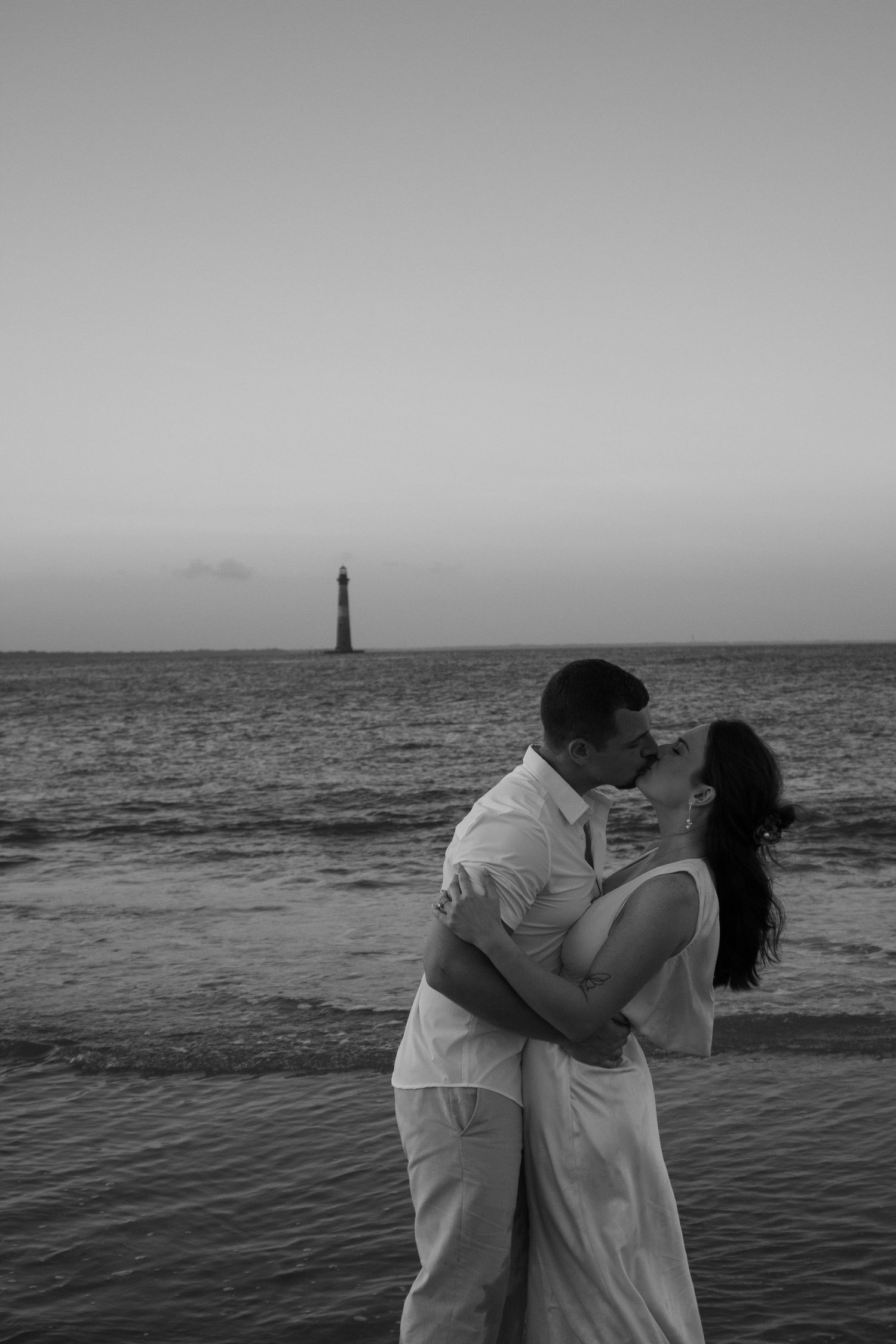 beach elopements, couple kissing on beach, folly beach